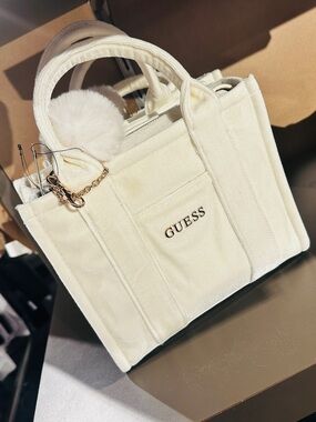GUESS Cream Velvet Tote with Pom Charm and Gold Logo